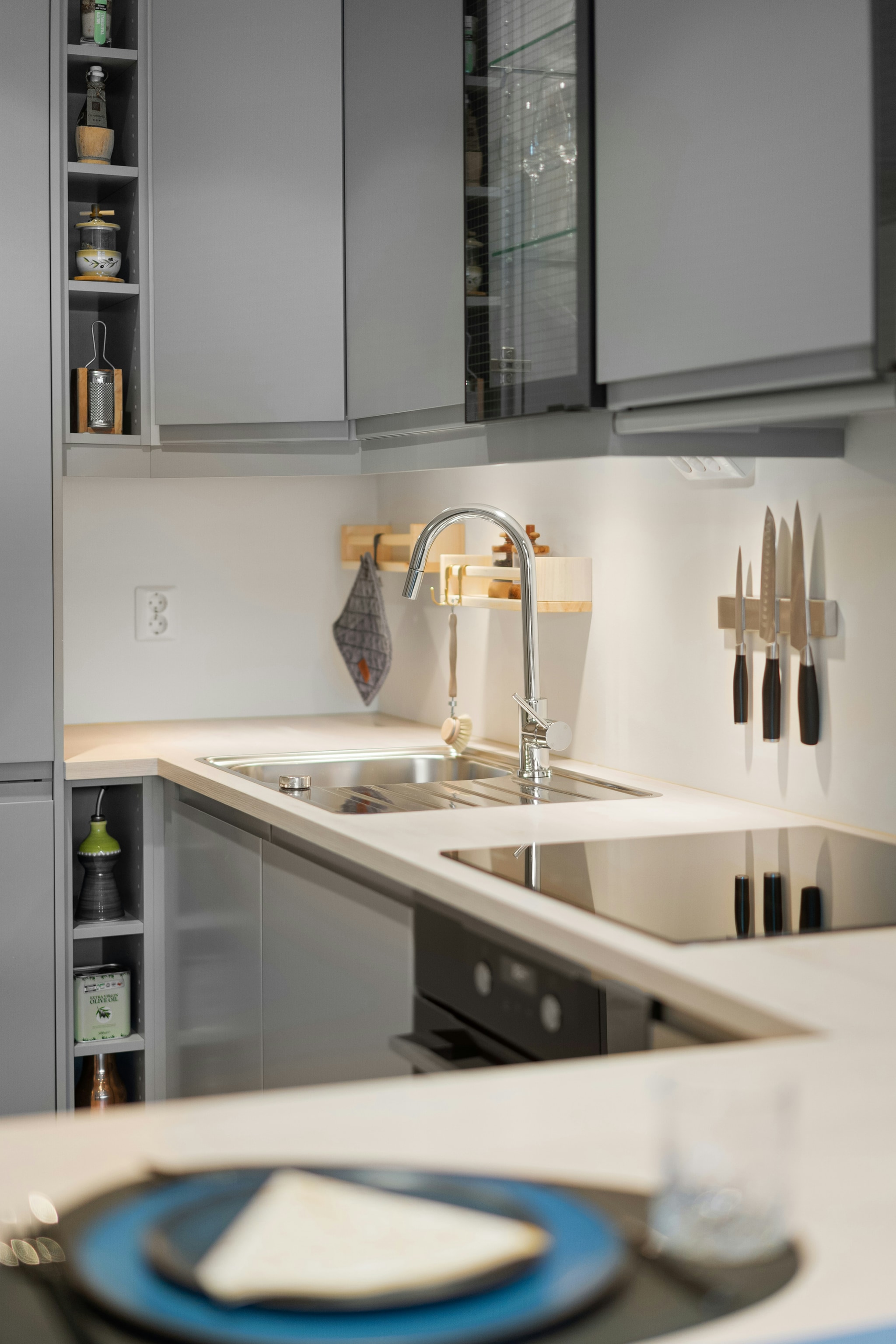 Kitchen — Hob, hood, worktops and floor detailed to a mirror finish.
