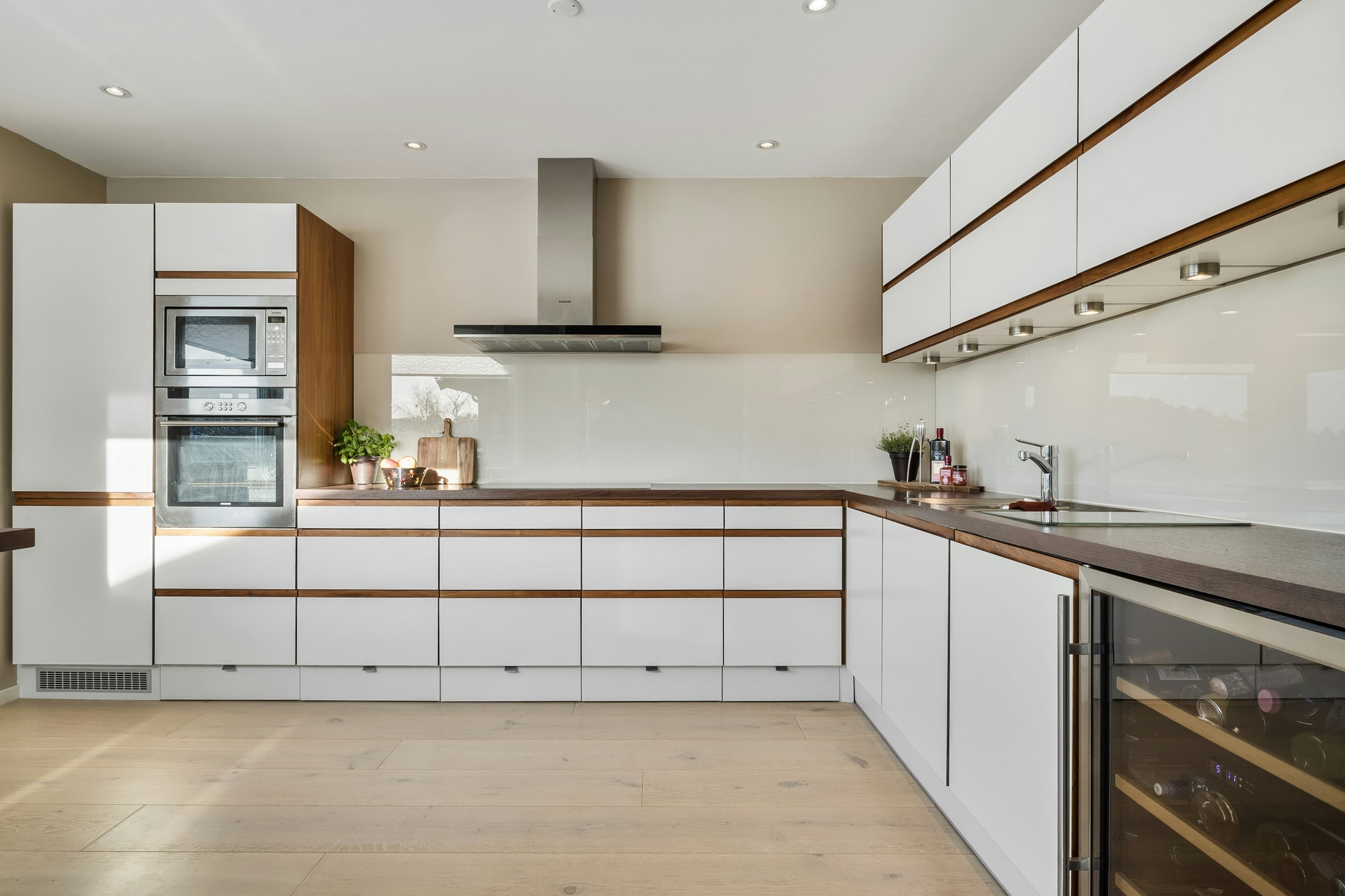 Kitchen — Full kitchen reset — cabinets, appliances and grout restored.